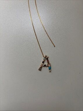 Anthropologie Gold-Tone Initial 'A' Pendant Necklace with Multicolor Stones